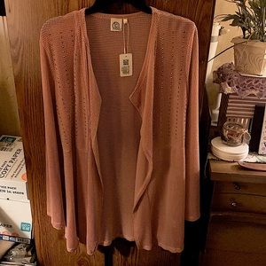 Light pink, with diamonds down the front.slinky material .